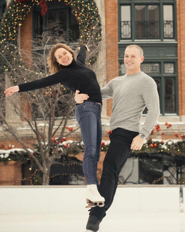 Ekaterina Gordeeva in a black high neck sweater and blue jeans skating with her partner.